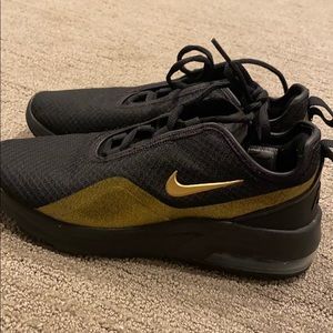 Black and gold Nike sneakers